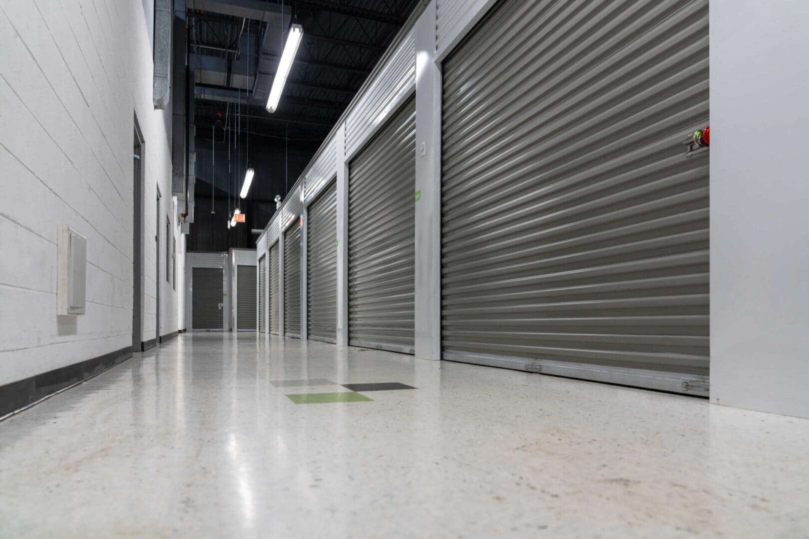 Storage unit hallway with closed doors.