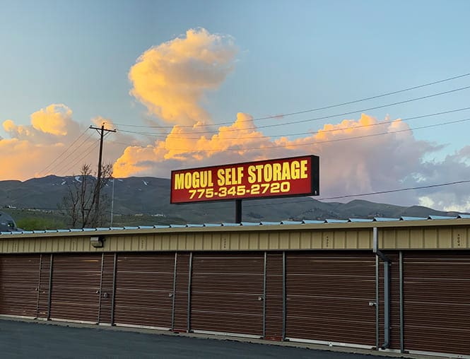 A sign on the side of a road advertising storage.